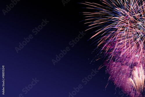 Colorful firework on the night sky. New Year celebration fireworks. Abstract firework isolated on black background with free space for text