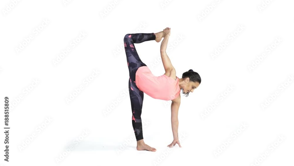 Young attractive woman practicing yoga doing Ardha Chandrasana posture in full length, isolated over white studio background Young attractive woman practicing yoga doing Ardha Chandrasana posture in full length, isolated over white studio background