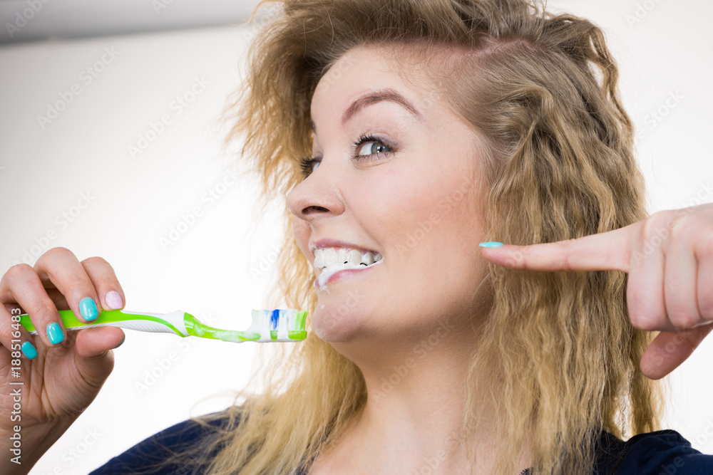 Woman brushing cleaning teeth Woman brushing cleaning teeth