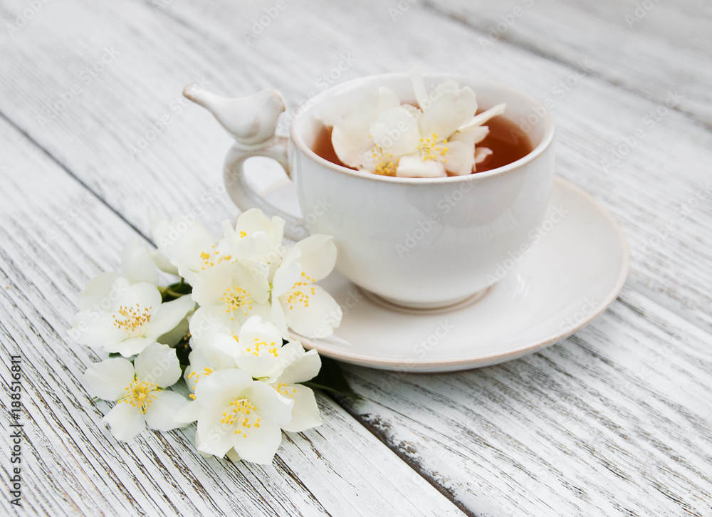 Cup of tea with jasmine flowers Cup of tea with jasmine flowers