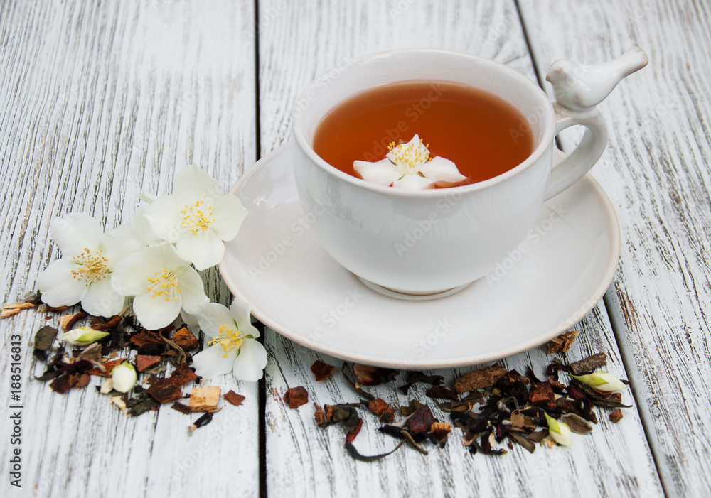 Cup of tea with jasmine flowers Cup of tea with jasmine flowers