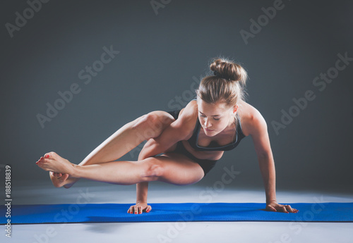 Portrait of sport girl doing yoga stretching exercise . yoga