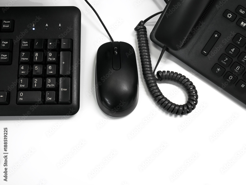 Black keyboard, mouse and telephone on white background Black keyboard, mouse and telephone on white background