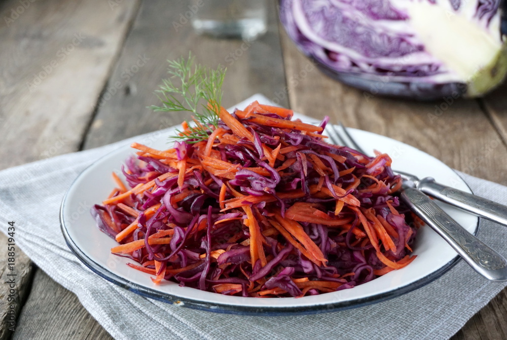 Salad with red cabbage and carrots in a plate Salad with red cabbage and carrots in a plate