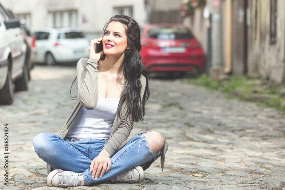 Cute urban girl talking on the phone. Cute urban girl talking on the phone.