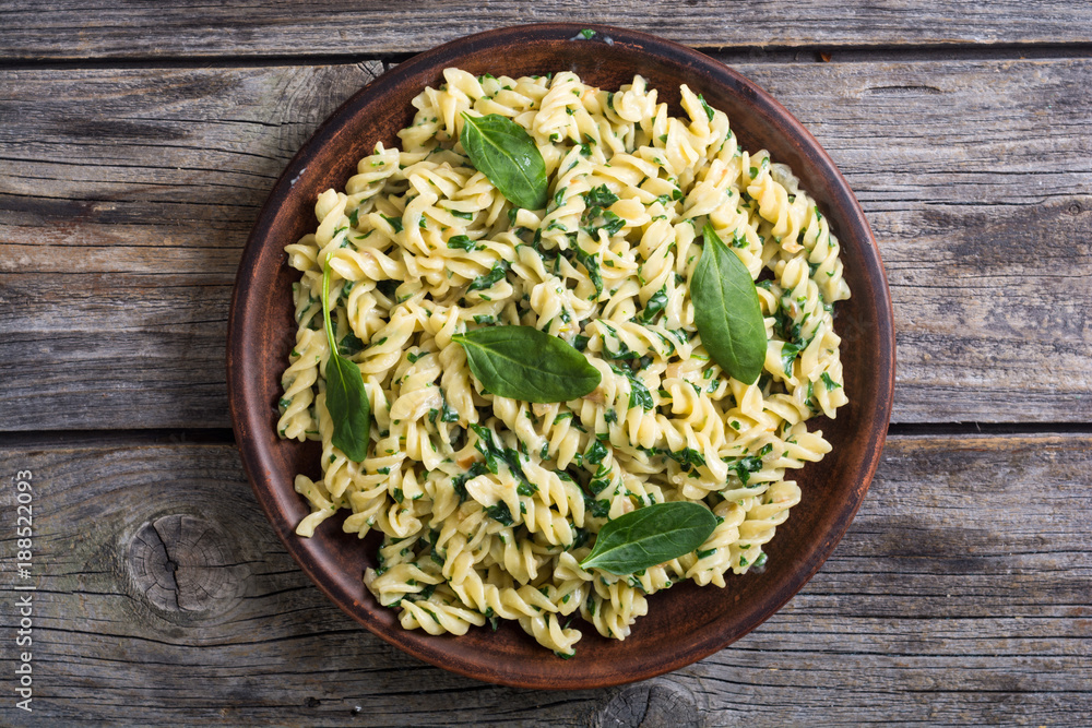 Pasta with baby spinach Stock Photo | Adobe Stock