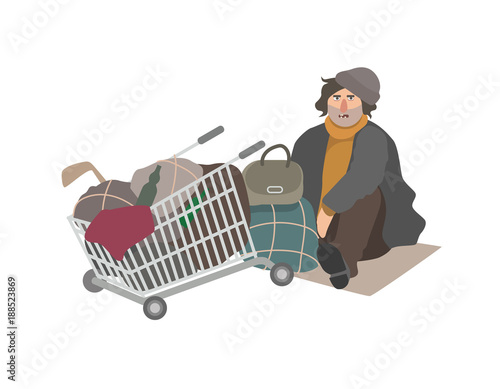 Angry homeless man dressed in shabby clothes sitting on cardboard sheet on street beside shopping cart full of old junk and trash. Cartoon character isolated on white background. Vector illustration.