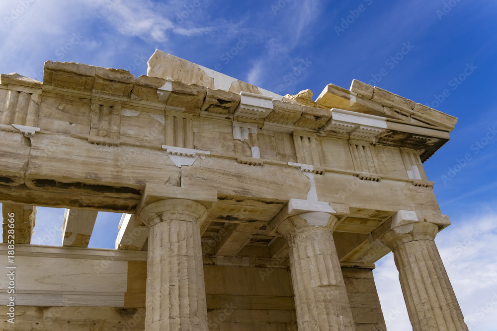 Athens Acropolis Parthenon temple detail with remaining columns and roof structure. Day view of the ruins of the temple that dominates the hill of the Acropolis at Athens, dedicated to goddess Athena
