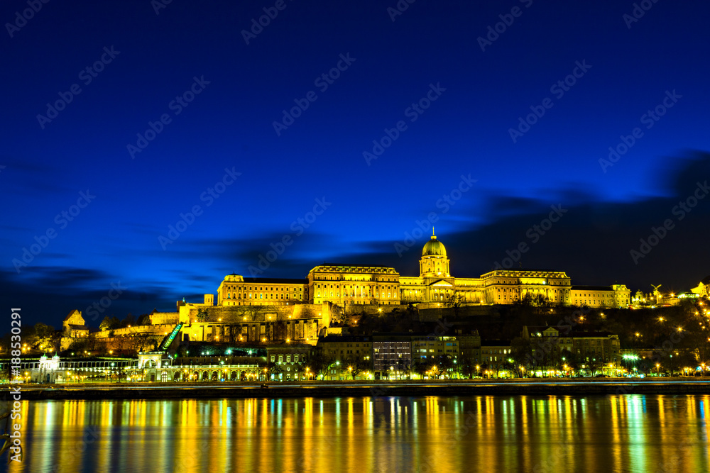 Illuminated building of Buda Castle and Chain bridge at night in  Budapest.