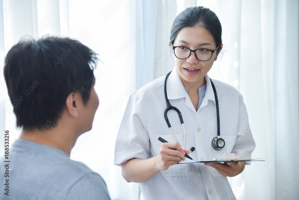 Female Doctor examining male patients. Female Doctor examining male patients.
