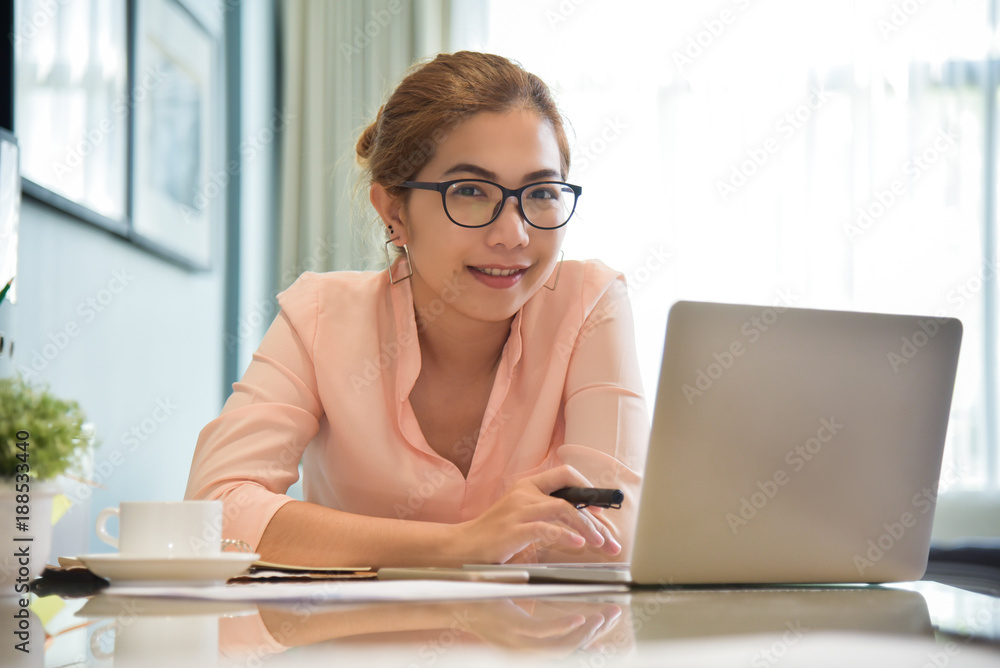 Happy Young Asian Female creative designer working. Happy Young Asian Female creative designer working.