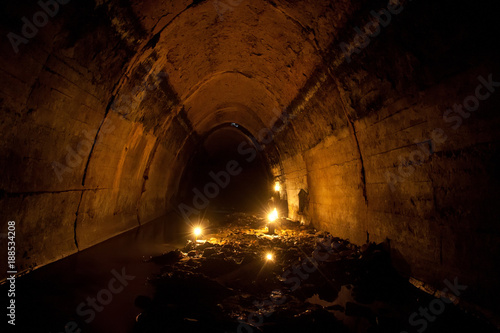 Flooded by dirty industrial wastewater sewage collector. Sewer tunnel under city full of garbage 