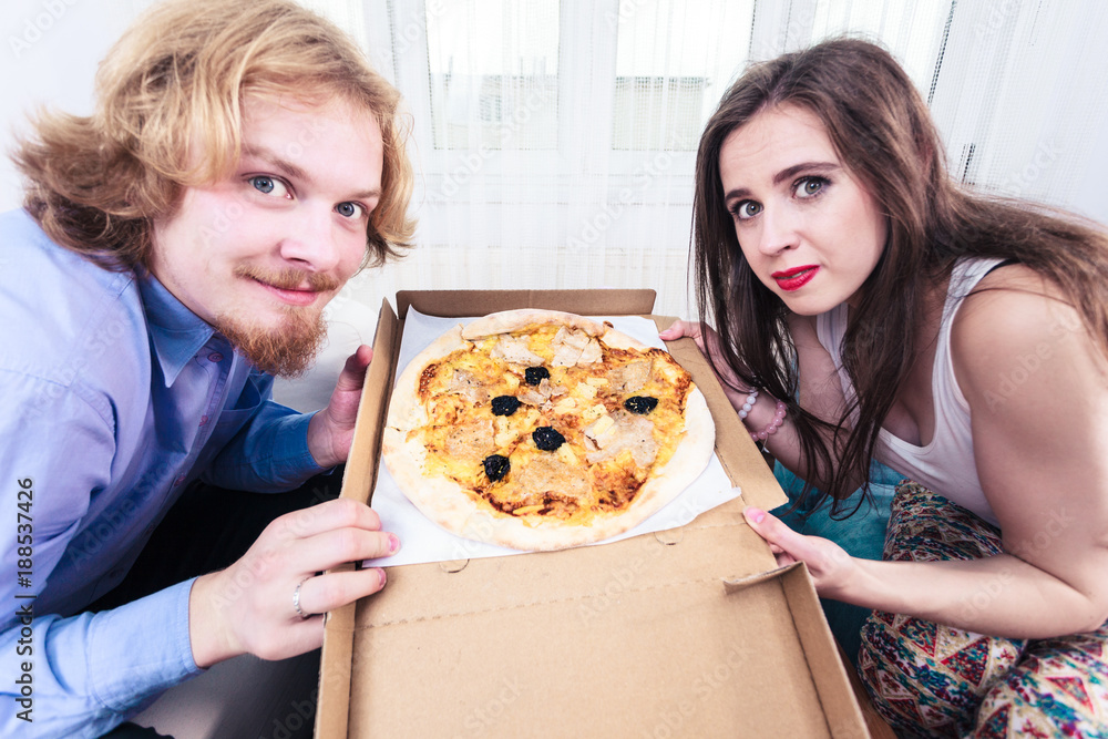 Couple eating pizza, having fun together. Couple eating pizza, having fun together.