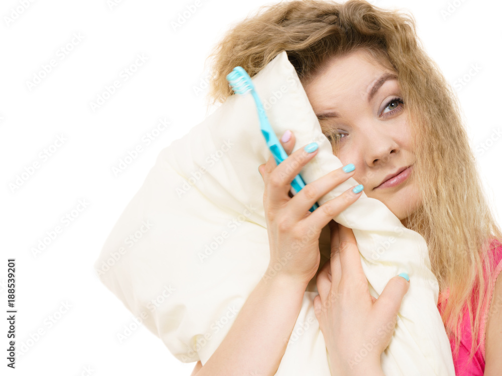 Sleepy woman hugging white pillow Sleepy woman hugging white pillow