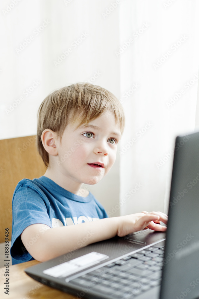 Little boy using laptop Little boy using laptop