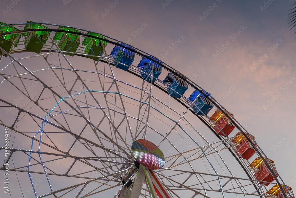 Partial view of a full colored Ferris wheel attraction at a local Christmas festival, at Torrejon de Ardoz, Madrid, Spain