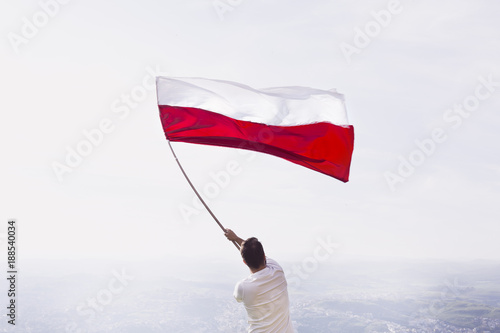 man with red and white flag