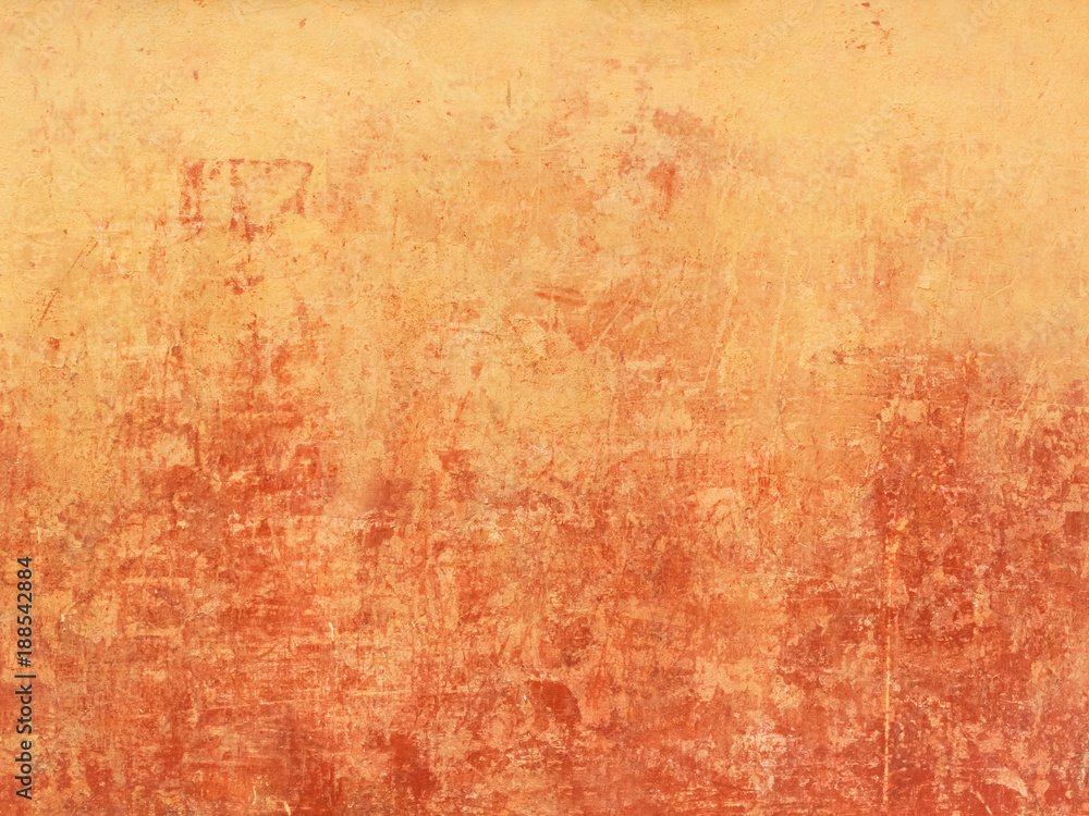 Old orange wall with red spots from below Old orange wall with red spots from below