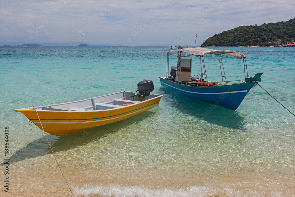 Bright colorful touristic boats anchored near beach, Redang island, Malaysia