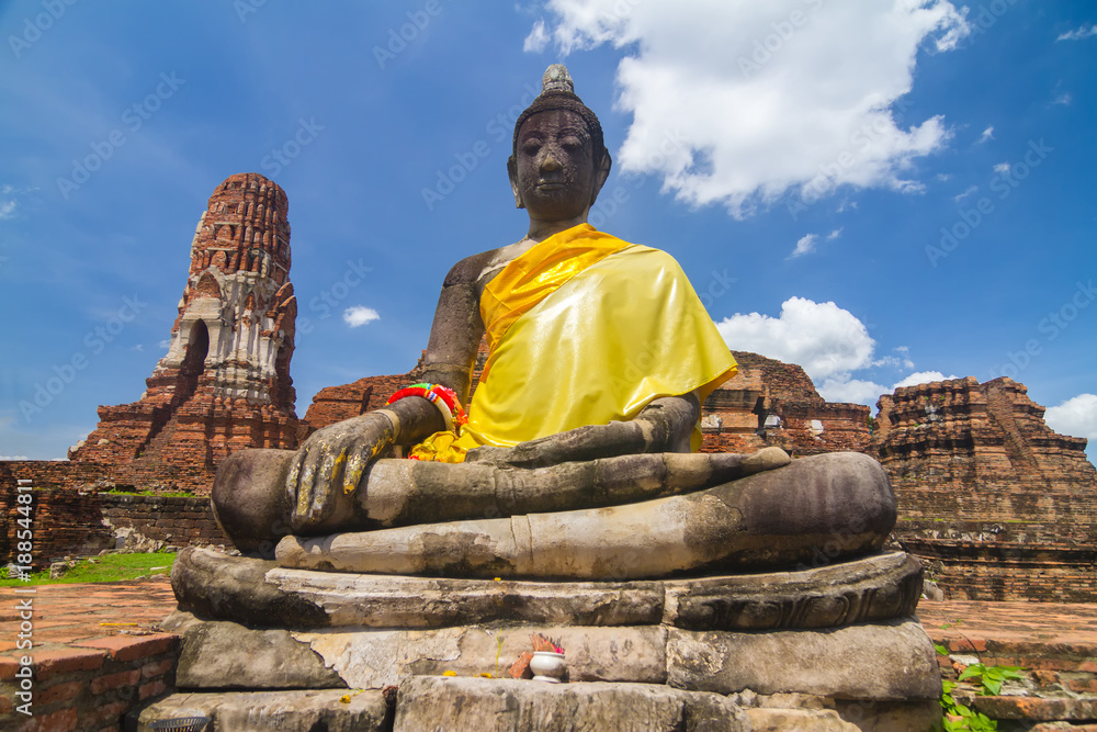 Fototapeta premium The Buddha statues and temples at Ayuthaya province which surviving from the war between Thailand and Burma.