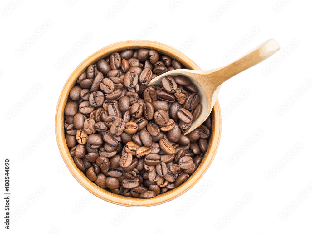 Fototapeta premium Coffee beans in a wooden bowl with a spoon seen from above isolated on white background