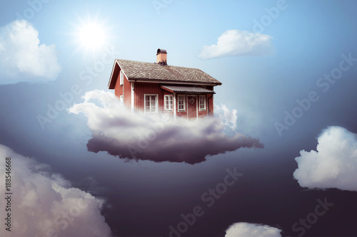 Bild auf Leinwand Haus auf einer Wolke