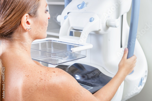 Woman undergoing medical mammography scan photo
