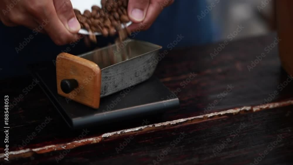Barista weighs the coffee beans. Process Weighing freshly coffee. Close up. Barista weighs the coffee beans. Process Weighing freshly coffee. Close up.