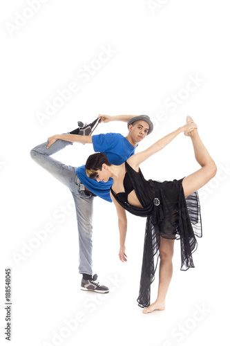 Two modern ballet dancers in dynamic action figure, on white background