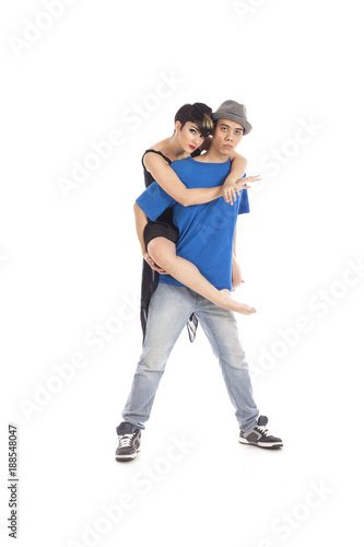 Couple of two dancers posing and huging.
