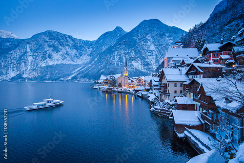 Hallstatt lakeside town with ship in winter twilight, Salzkammergut, Austria