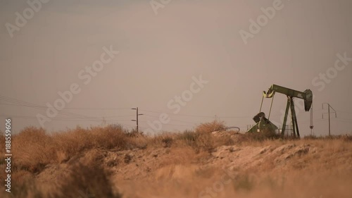 Petroleum Industry Pumpjack Overground Drive. Piston Pump and the Oil Well. California, United States of America.
