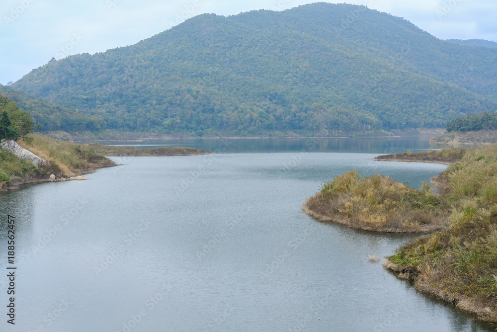 Naklejka premium landscape of dam & forest on mountain. serene lake view