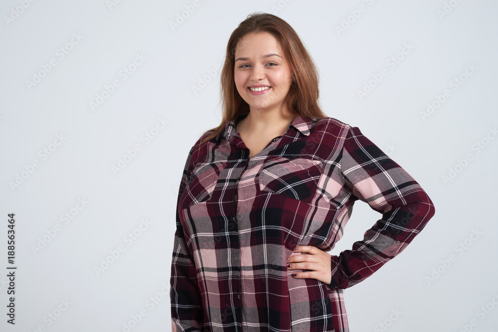 Attractive young girl posing against background Attractive young girl posing against background
