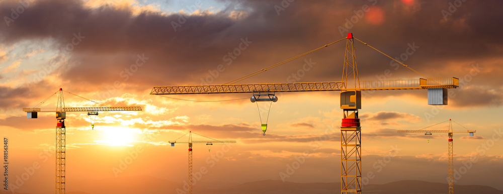 Construction cranes on sunset or sunrise background. 3d illustration