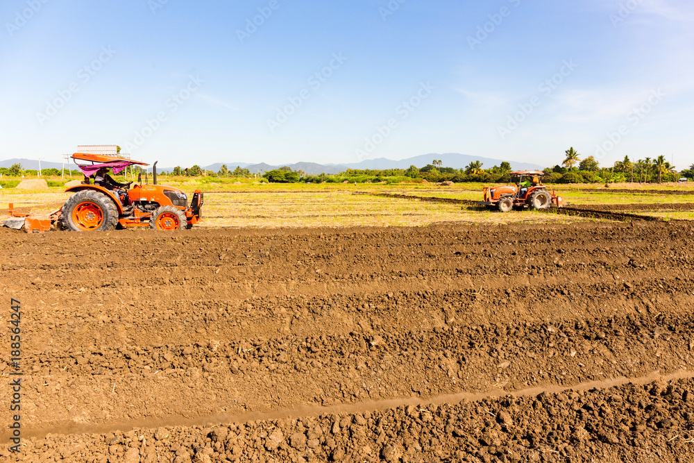 Fototapeta premium Tractor preparing land
