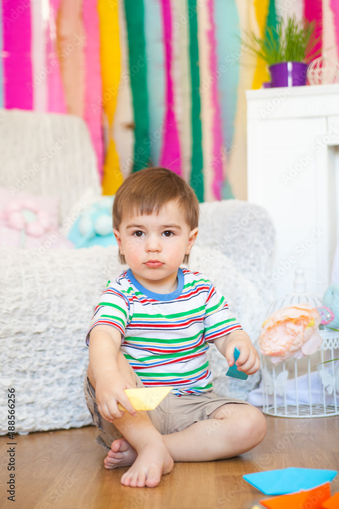 Cute boy in a spring easter studio decorations Cute boy in a spring easter studio decorations