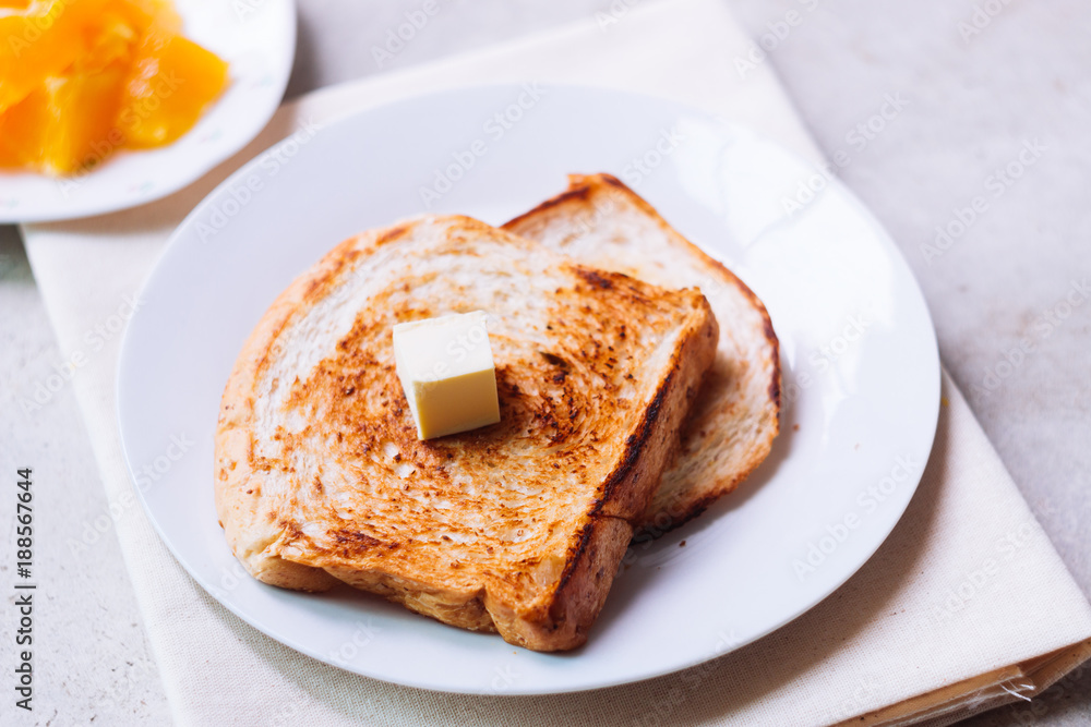 Toast bread on white plate.