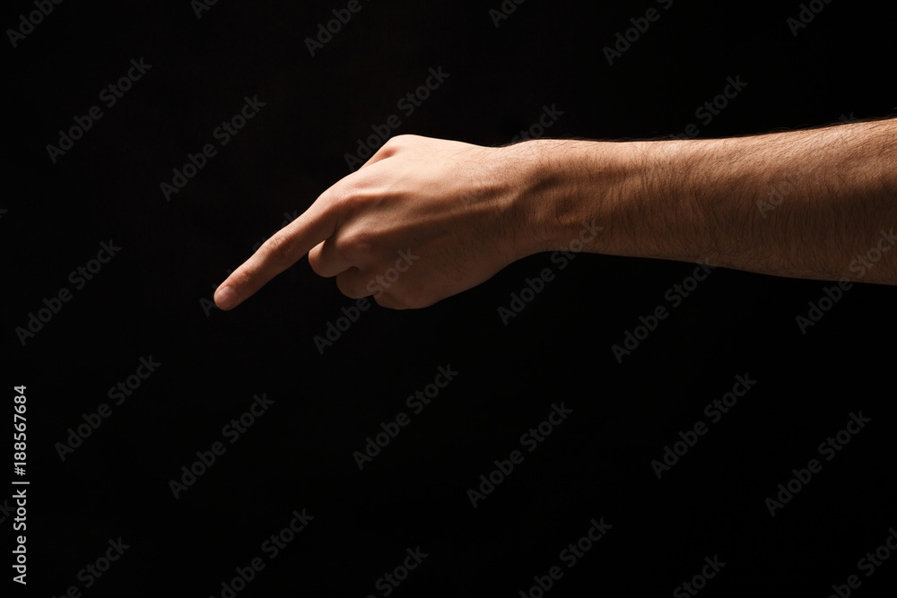 Hand gestures - man pointing, isolated at black