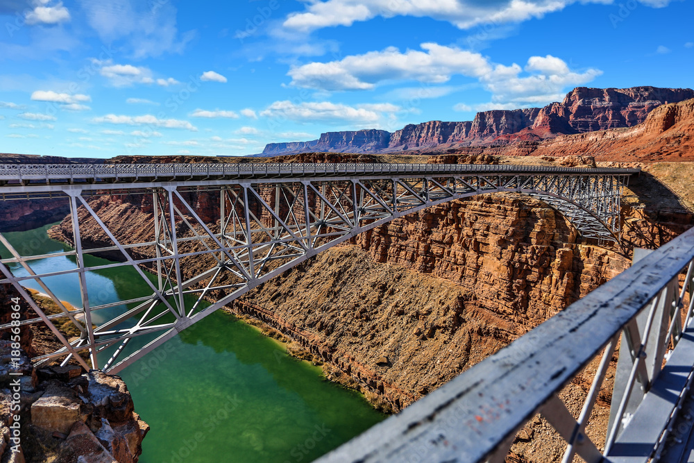 Navajo Bridge Across the Colorado River at Glen Canyon with Red Rock Mountains in the Background