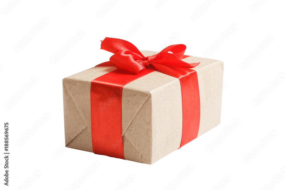 Box with gift wrapped in kraft paper and tied with red ribbon. Isolated on white. Box with gift wrapped in kraft paper and tied with red ribbon. Isolated on white.