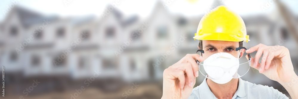 Construction Worker on building site wearing mask Construction Worker on building site wearing mask