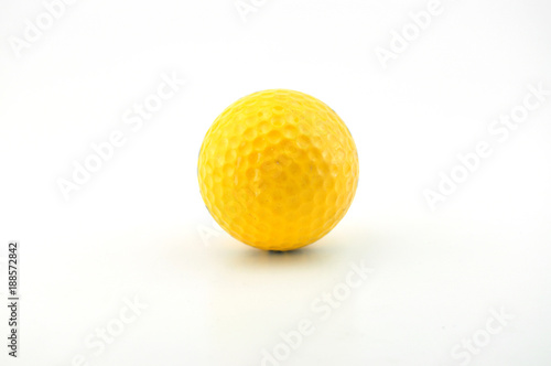 A yellow golf ball isolated on white background