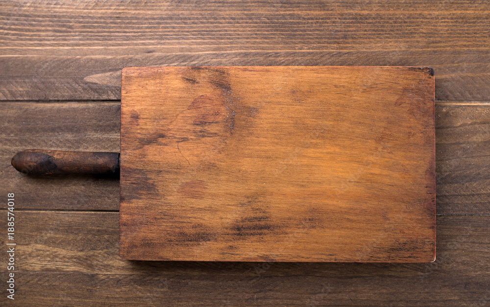 Brown wooden tray on wooden table. Brown wooden tray on wooden table.