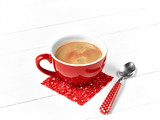red coffee cup on wood table