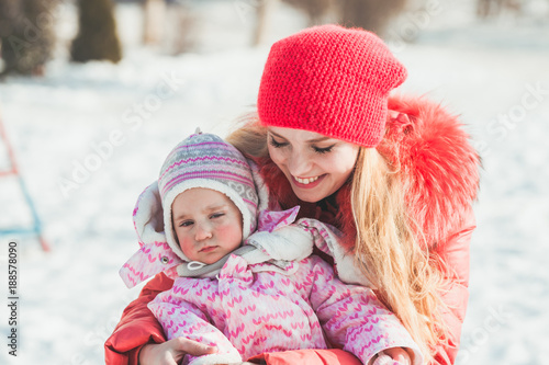 Portrait of mother and daughter in winter