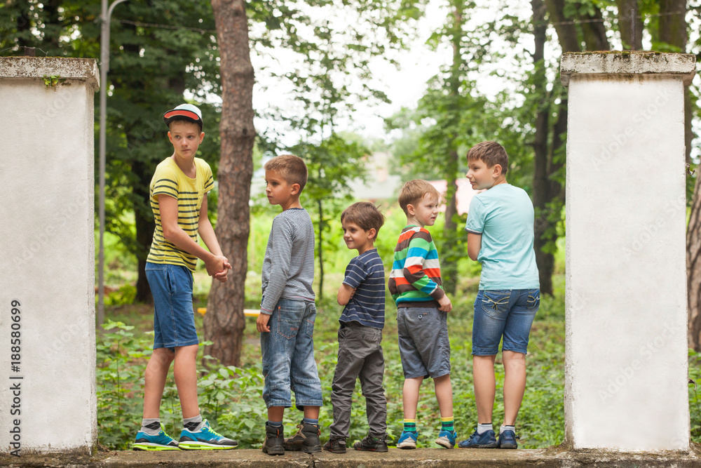 Fototapeta premium Group of guys in a row back view
