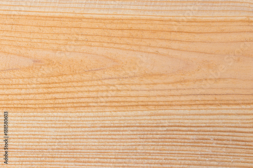 Rough cut wooden plank closeup background with copy space.