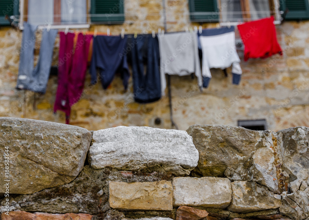Clothes Stretched Out To Dry Out Of A House In The Old Town Centre