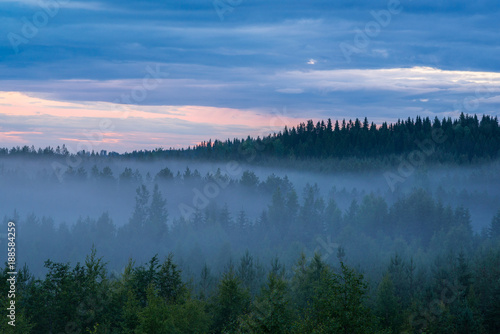 Misty summer night landscape in Finland